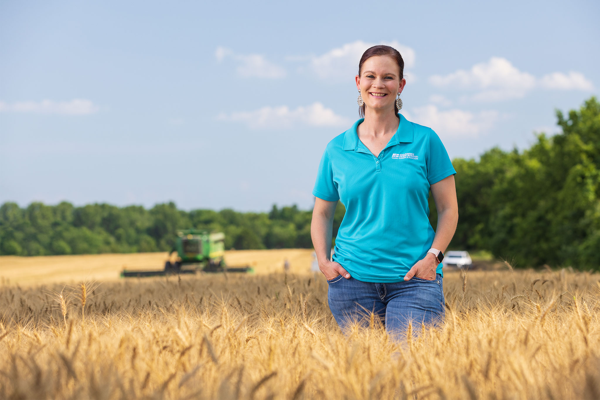 Alisen Anderson stands in a wheat field on her family's Miami, Oklahoma, farm.