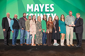 Mayes County Farm Bureau members receive their 2024 Oklahoma Farm Bureau County Excellence Award from OKFB President Rodd Moesel during the 2024 OKFB Annual Meeting Awards Banquet Saturday, Nov. 9 in Oklahoma City.