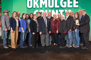 Okmulgee County Farm Bureau members receive their 2024 Oklahoma Farm Bureau County Excellence Award from OKFB President Rodd Moesel during the 2024 OKFB Annual Meeting Awards Banquet Saturday, Nov. 9 in Oklahoma City.