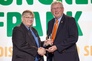 Rep. Frank Lucas (right) accepts the 2024 Oklahoma Farm Bureau Distinguished Service to Agriculture Award from OKFB President Rodd Moesel during the 2024 OKFB Annual Meeting Awards Banquet Saturday, Nov. 9 in Oklahoma City.