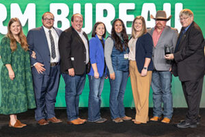 Okmulgee County Farm Bureau members accept the 2024 Charles L. Roff Award for top county YF&R program from OKFB President Rodd Moesel during the 2024 OKFB Annual Meeting Awards Banquet Saturday, Nov. 9 in Oklahoma City.